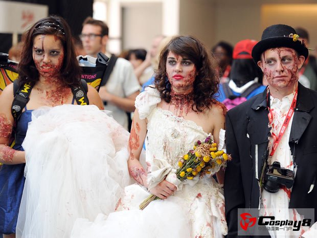 People dressed for a zombie wedding attend Comic Con