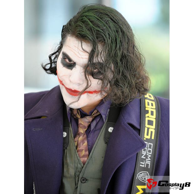 A fan dressed as The Joker from the Batman films and comics, walks to the Comic-Con International 2011 convention held in San Diego